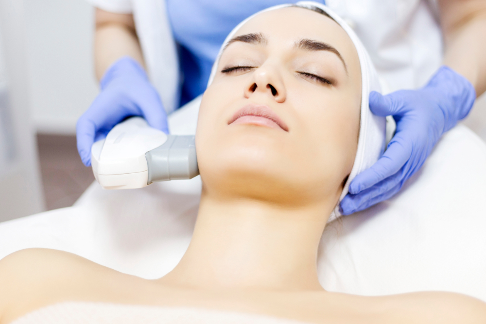 woman having laser facial treatment